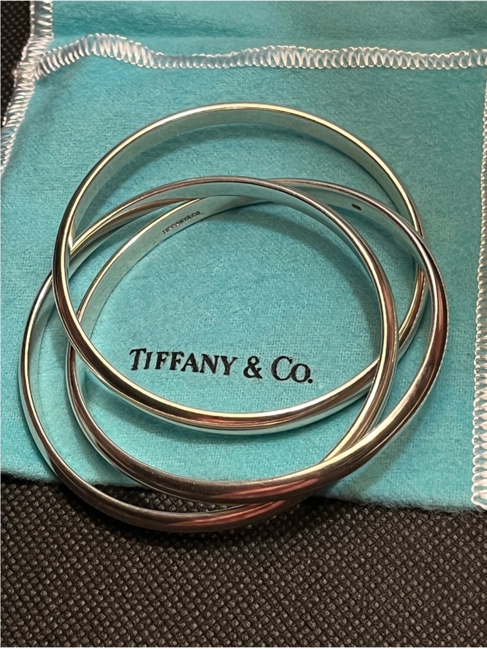 Tiffany & Co. Silver Stacking Bangles on Tiffany Blue Pouch